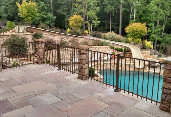 Patio railing with stonework and pool