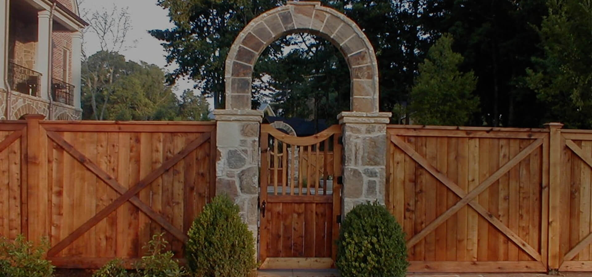 Wooden gate with brick archway
